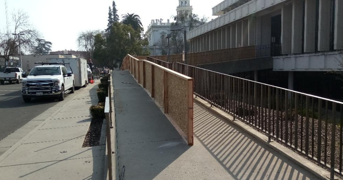  Workers recently replaced the railing in front of the Merced County Library Main Branch.  Photo:  Steve Nervine 