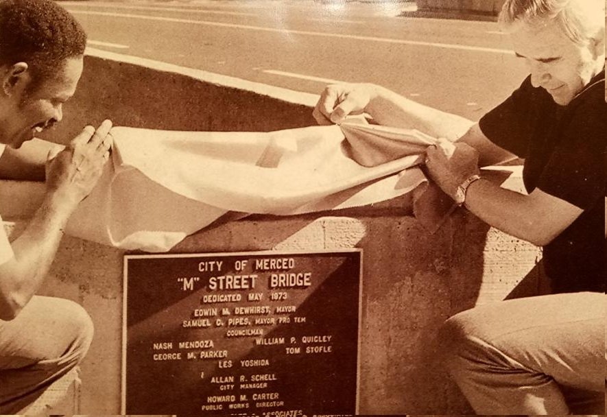 Merced Mayor Pro Tem Sam Pipes and Mayor Edwin Dewhirst view the plaque commemorating the opening of the M Street Bridge over Bear Creek in August 1973. The plaque remains at the bridge. It cost under three-hundred thousand dollars to build fifty years ago. Photo: Merced Courthouse Museum