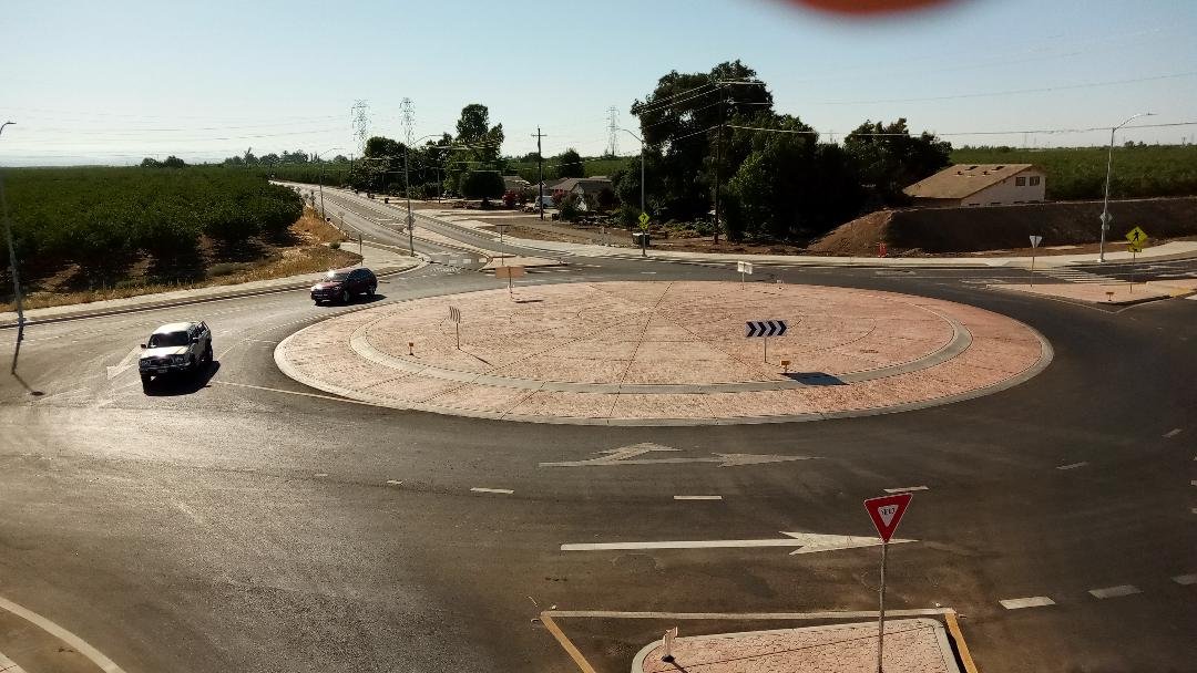 Traffic Circles and Straight Lines-