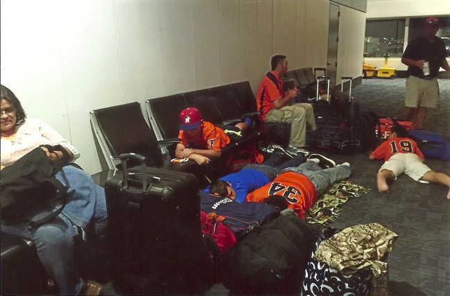 Jet Lagged and Road Weary, the Titans wait in an airport for the next leg of their journey.  Photo by Titans Elite