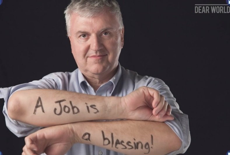  The words on my arms in this art presentation from about a decade ago still holds true. A job is a blessing. Photo: Newvine Personal Collection 
