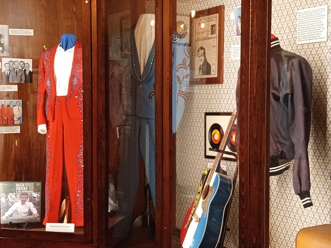  A display in the Bakersfield Sound exhibit at the Kern County Museum celebrating the music of Buck Owens, his lead guitarist Don Rich, and Buck’s son Buddy Alan Owens.. Photo: Steve Newvine 