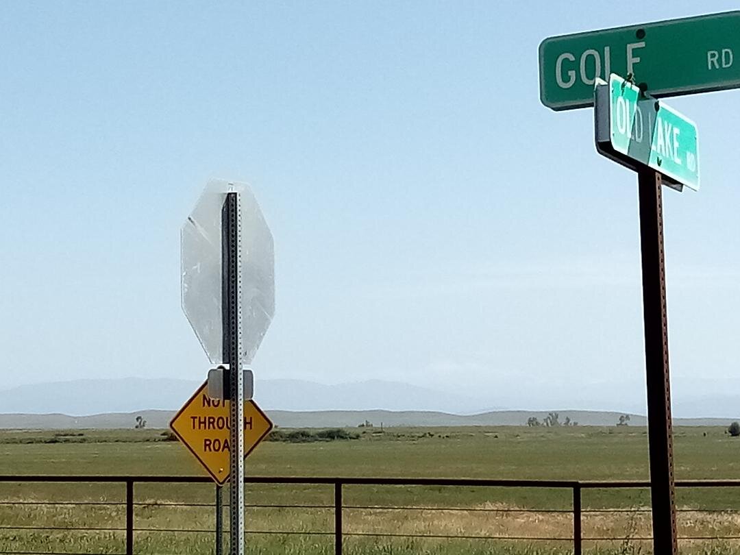 Finding the spot where Half Dome is visible on a clear day is relatively easy. Head north at this intersection of Lake and Golf Roads, and pull off to the right for the view. Good luck. Photo: Steve Newvine